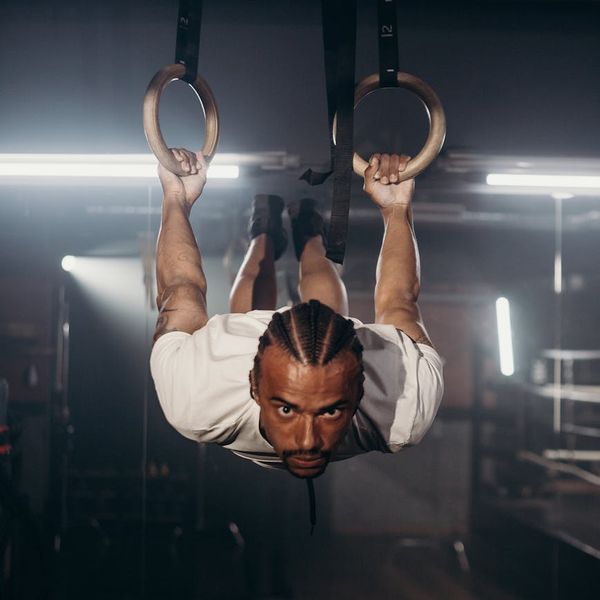 Man focused during a balance and strength exercise.